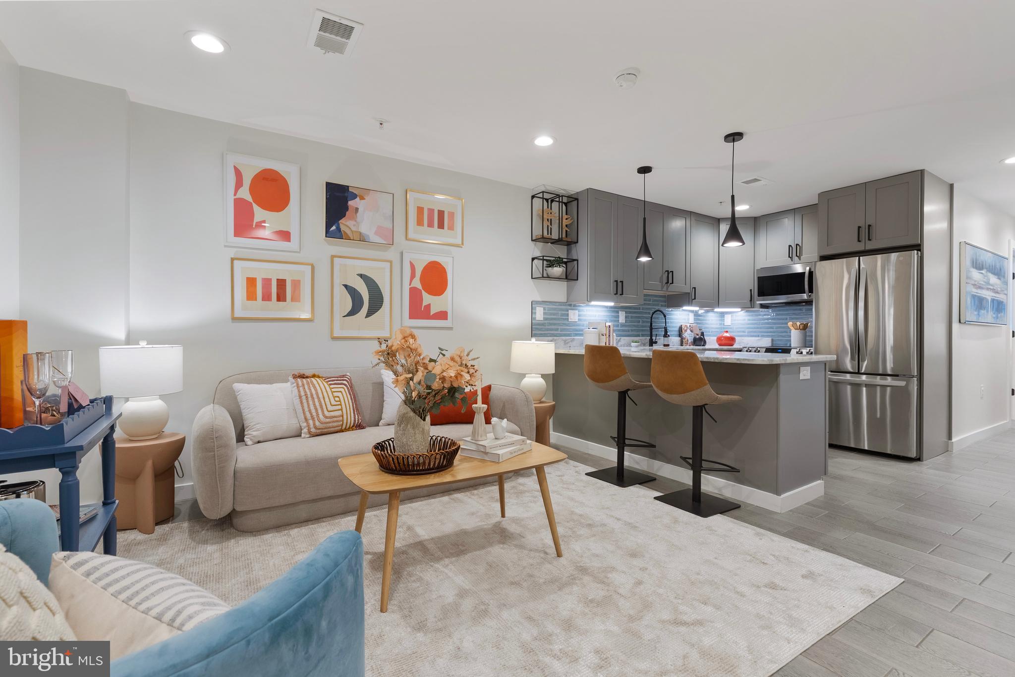 210 Varnum Street Northwest, Unit 1 Washington, DC 20011 - Photo 3 of 22 a living room with furniture and kitchen view