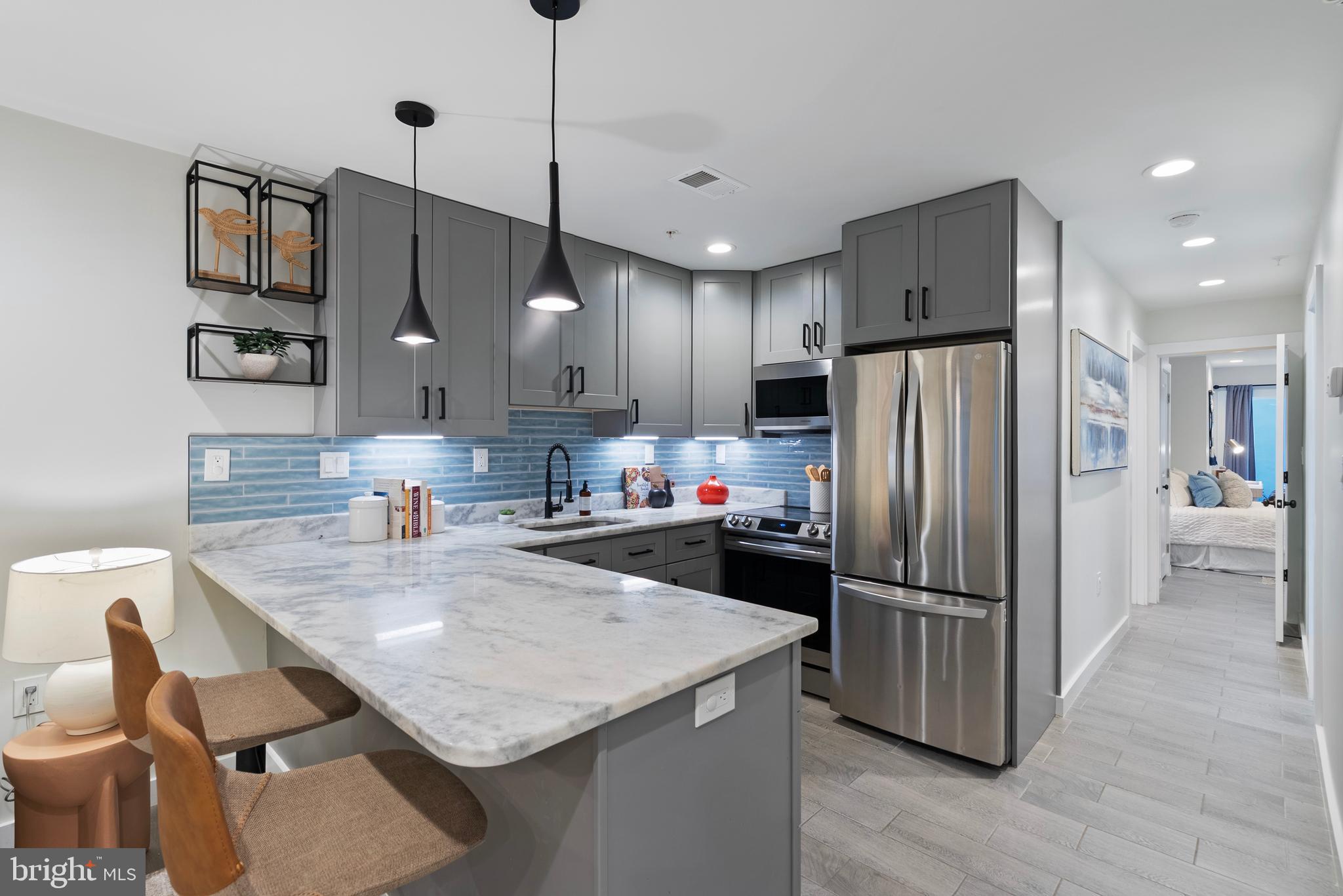 210 Varnum Street Northwest, Unit 1 Washington, DC 20011 - Photo 7 of 22 a kitchen with refrigerator cabinets and wooden floor