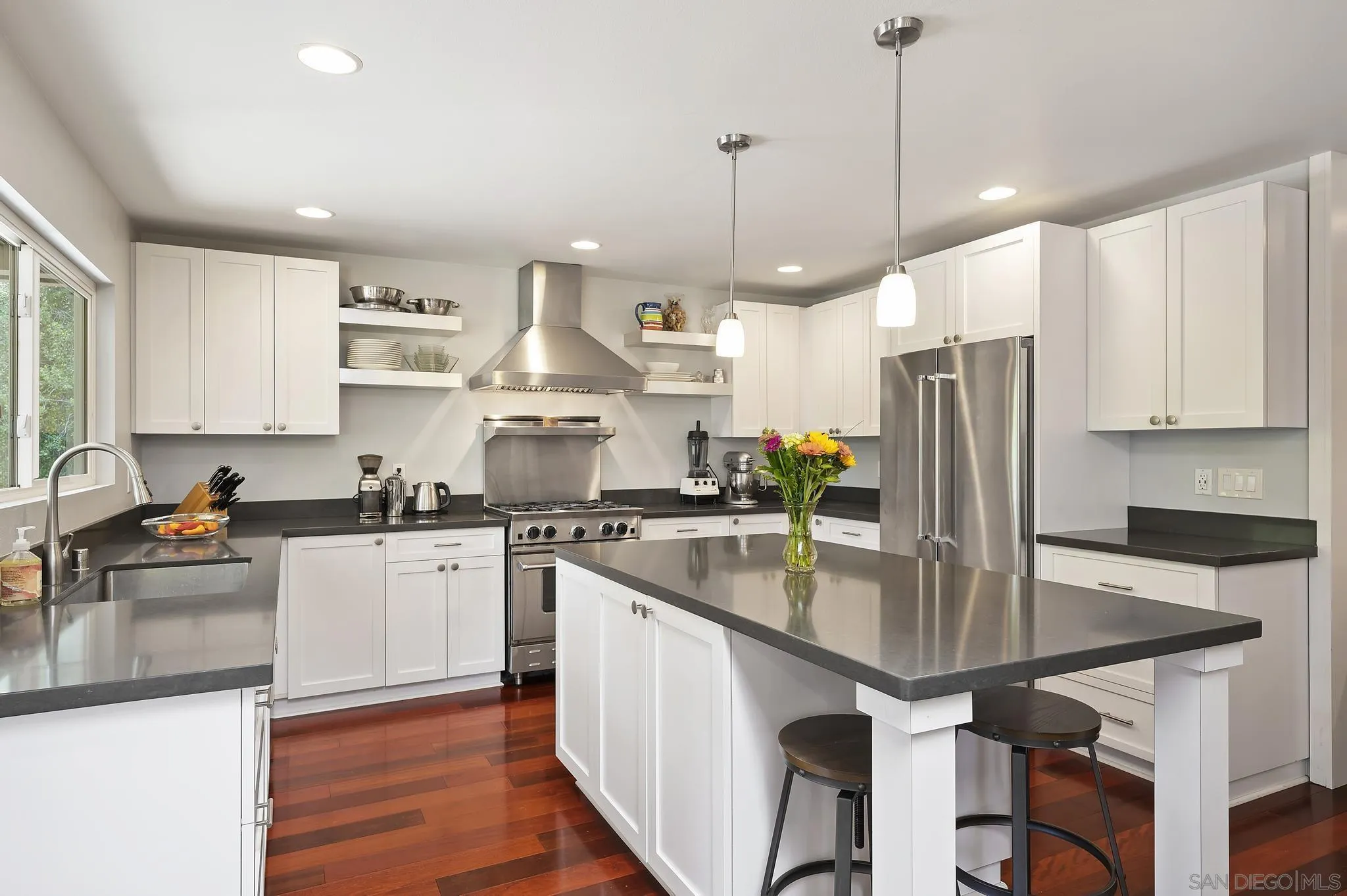 236 Rancho Santa Fe Road Encinitas, CA 92024 - Photo 9 of 32 a kitchen with stainless steel appliances granite countertop a sink a stove and a refrigerator