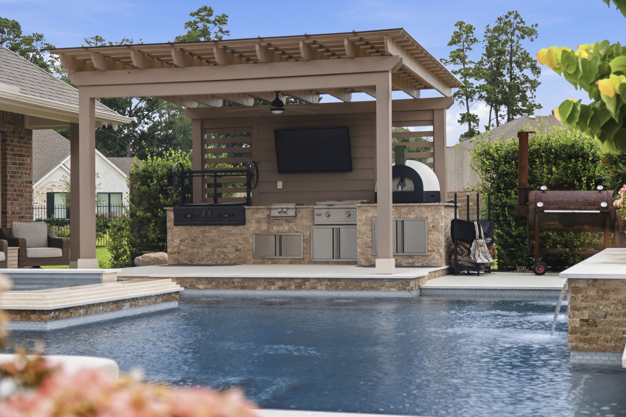 14012 Beartooth Bend Trail Conroe, TX 77384 - Photo 36 of 50 Take entertaining to the next level with this exceptional outdoor kitchen, thoughtfully designed for effortless al fresco dining and unforgettable gatherings.