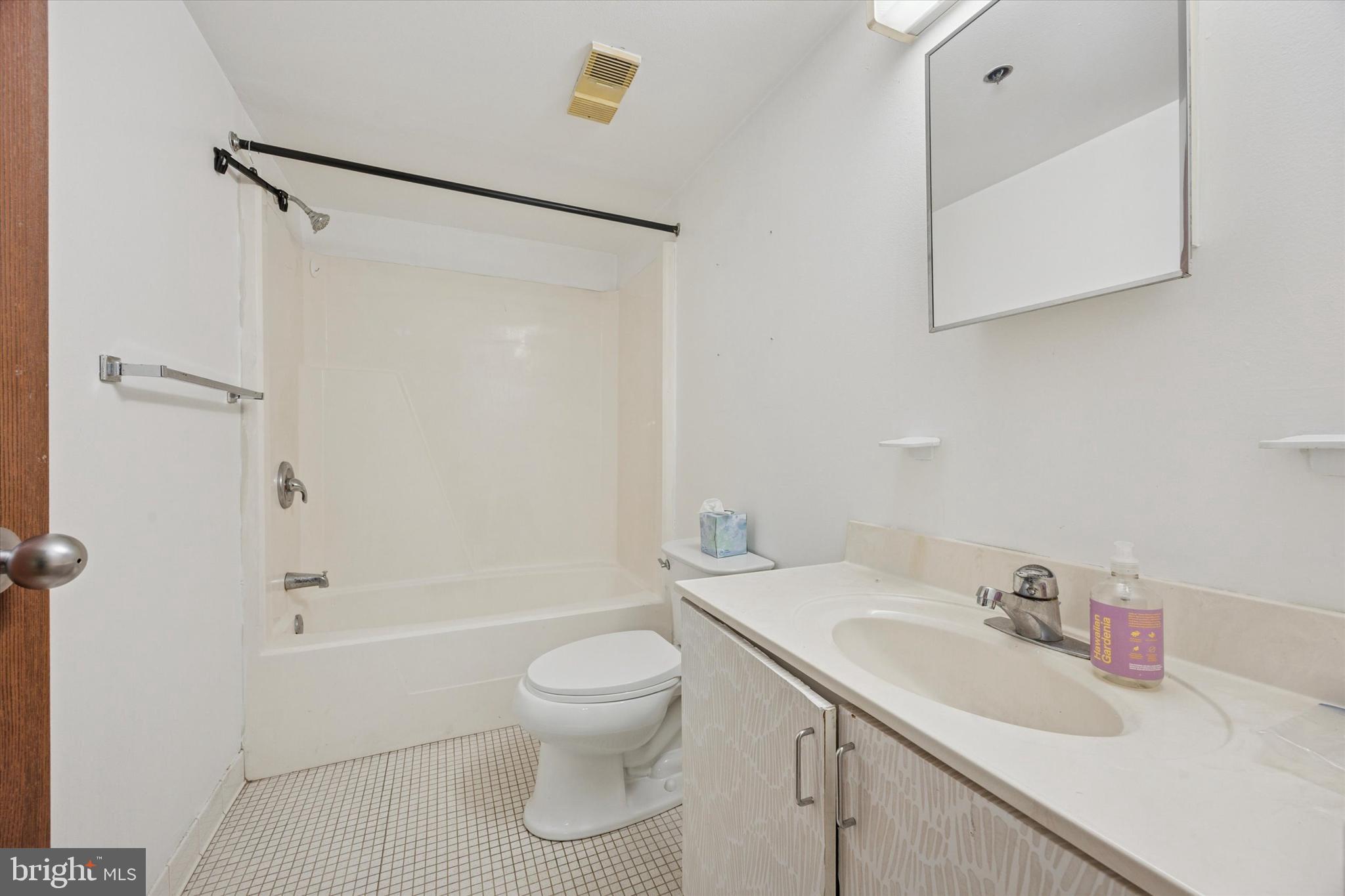 2201 Cherry Street, Unit 204 Philadelphia, PA 19103 - Photo 12 of 18 a bathroom with a sink toilet and shower