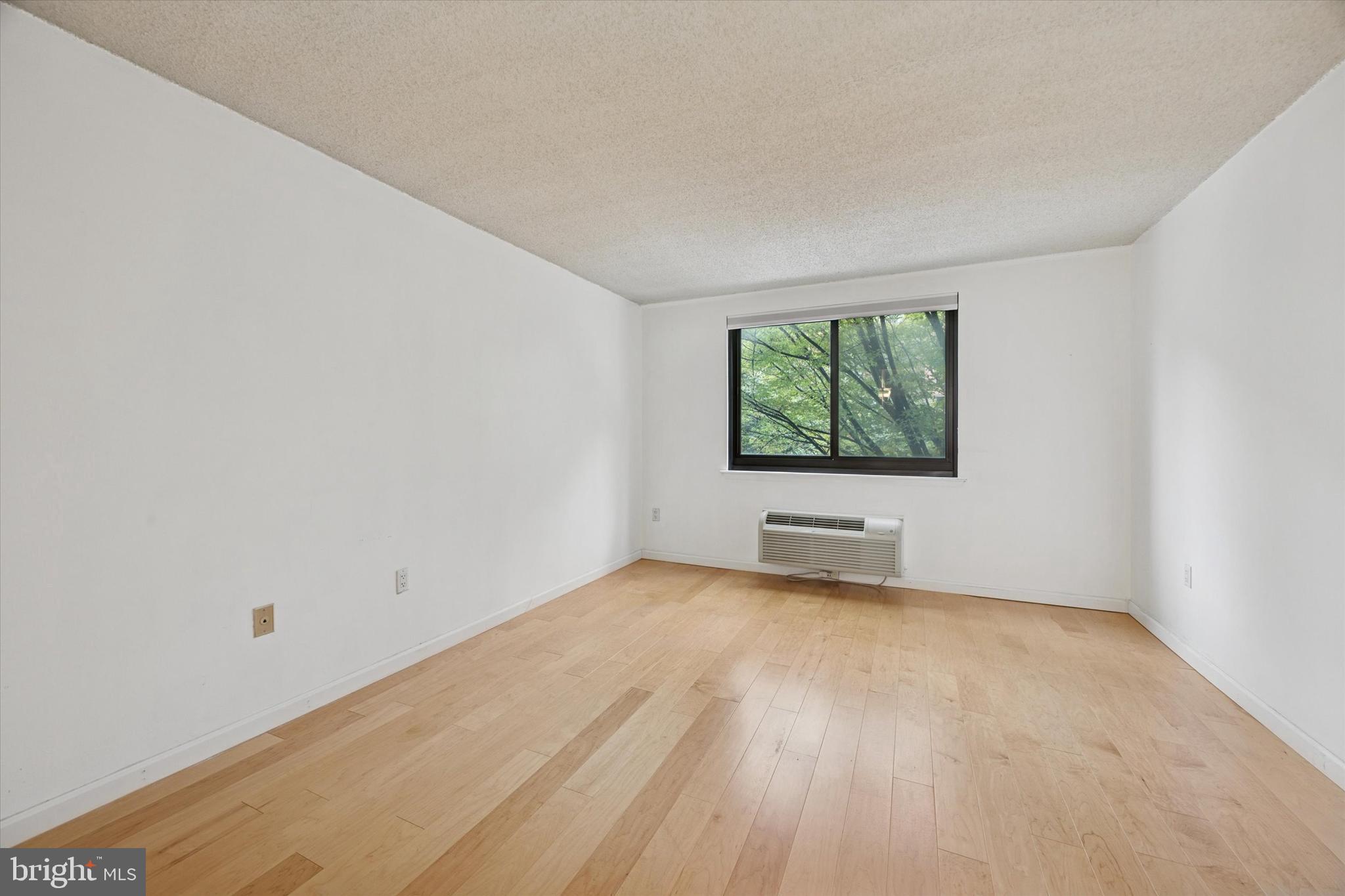 2201 Cherry Street, Unit 204 Philadelphia, PA 19103 - Photo 13 of 18 an empty room with windows