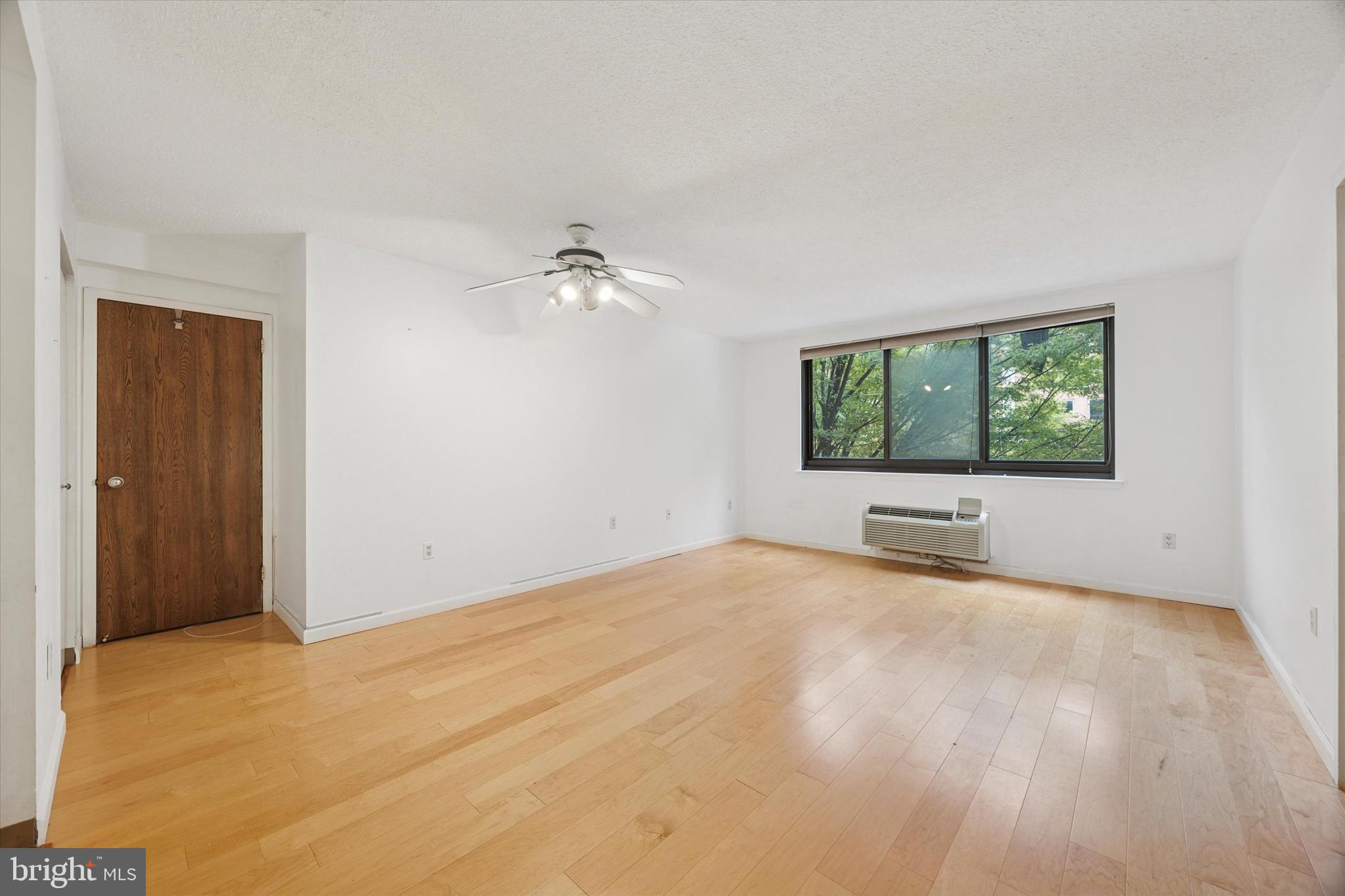 2201 Cherry Street, Unit 204 Philadelphia, PA 19103 - Photo 5 of 18 a view of an empty room with a window