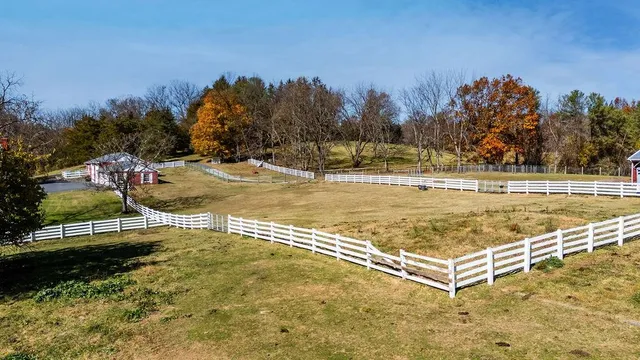 a view of a livingroom with a fireplace and window