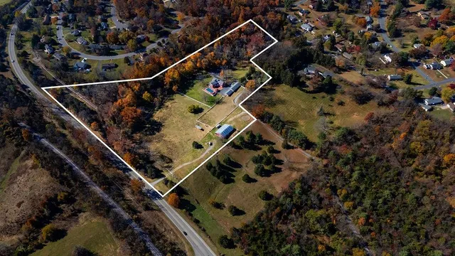 a view of a livingroom with an empty space and a fireplace