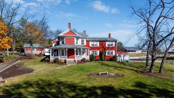 a front view of a building with garden