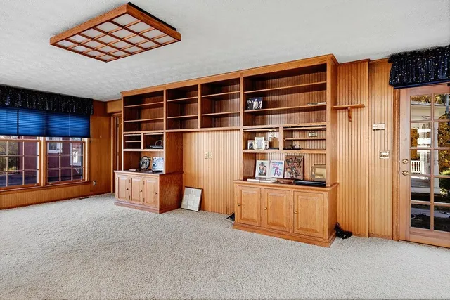 a view of a room with furniture and a window