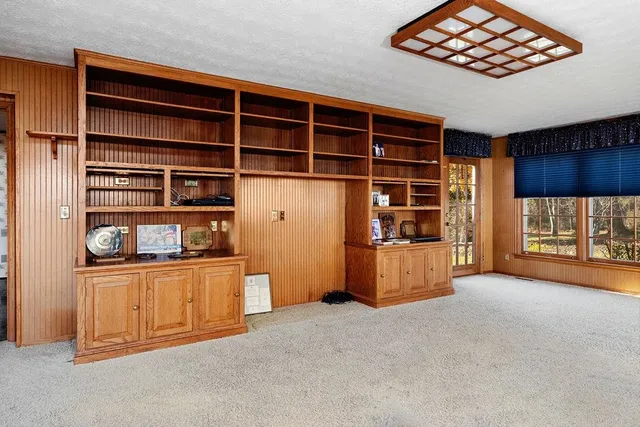 a view of room with window and wooden floor