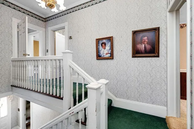 an empty room with wooden floor and closet