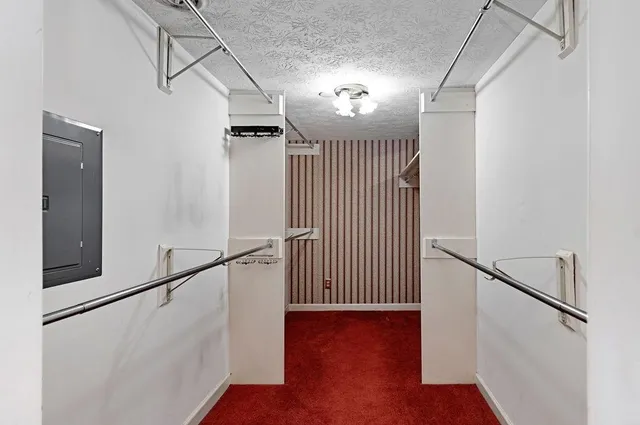 a room with wooden furniture and a fireplace