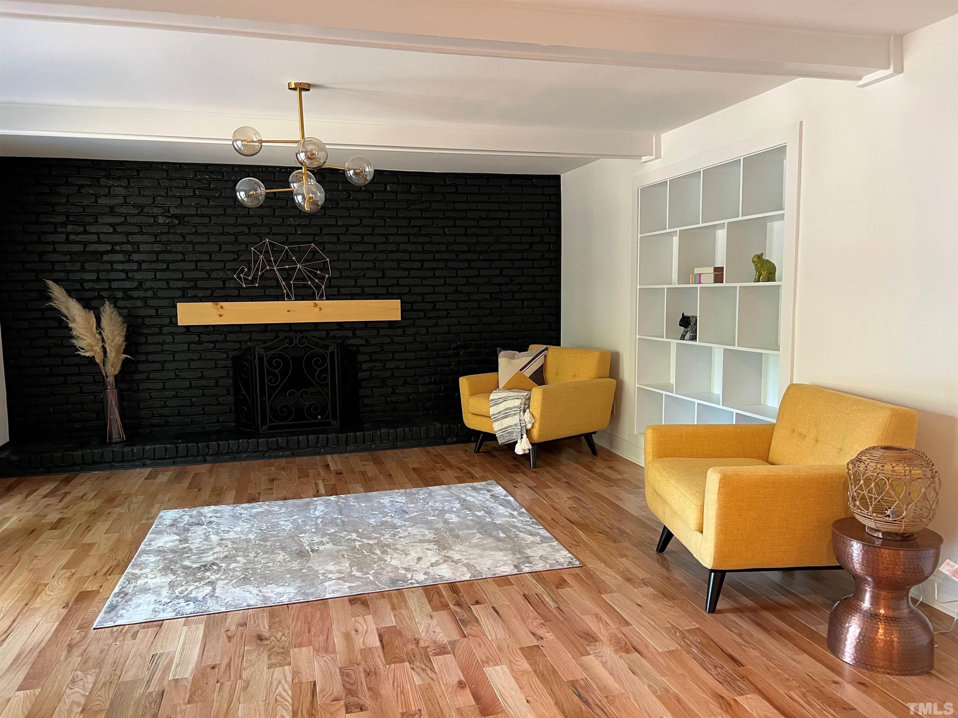 4200 Pickwick Drive Raleigh, NC 27613 - Photo 15 of 36 a living room with furniture and a rug