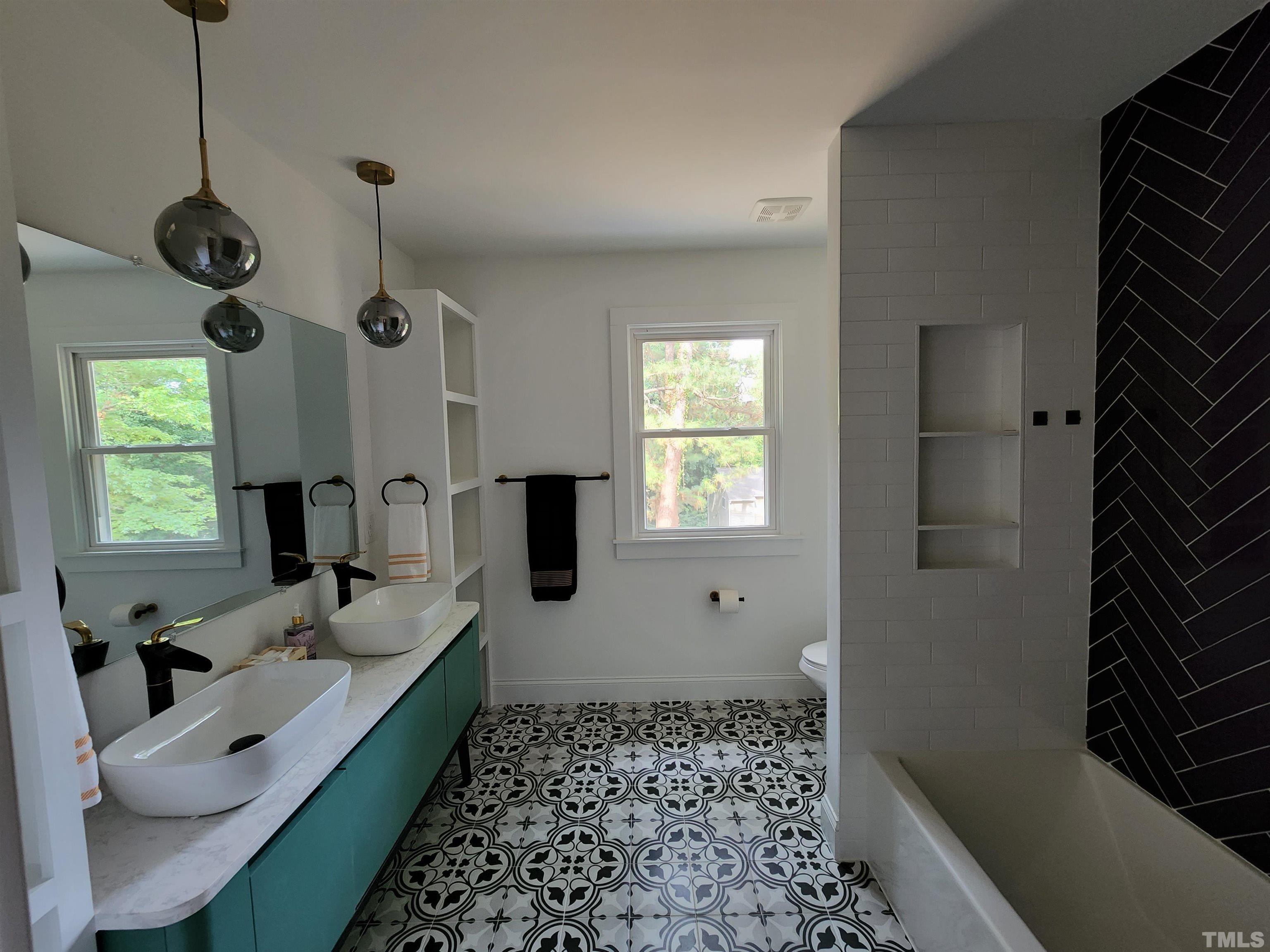 4200 Pickwick Drive Raleigh, NC 27613 - Photo 24 of 36 a very nice looking room with a big bed and a window