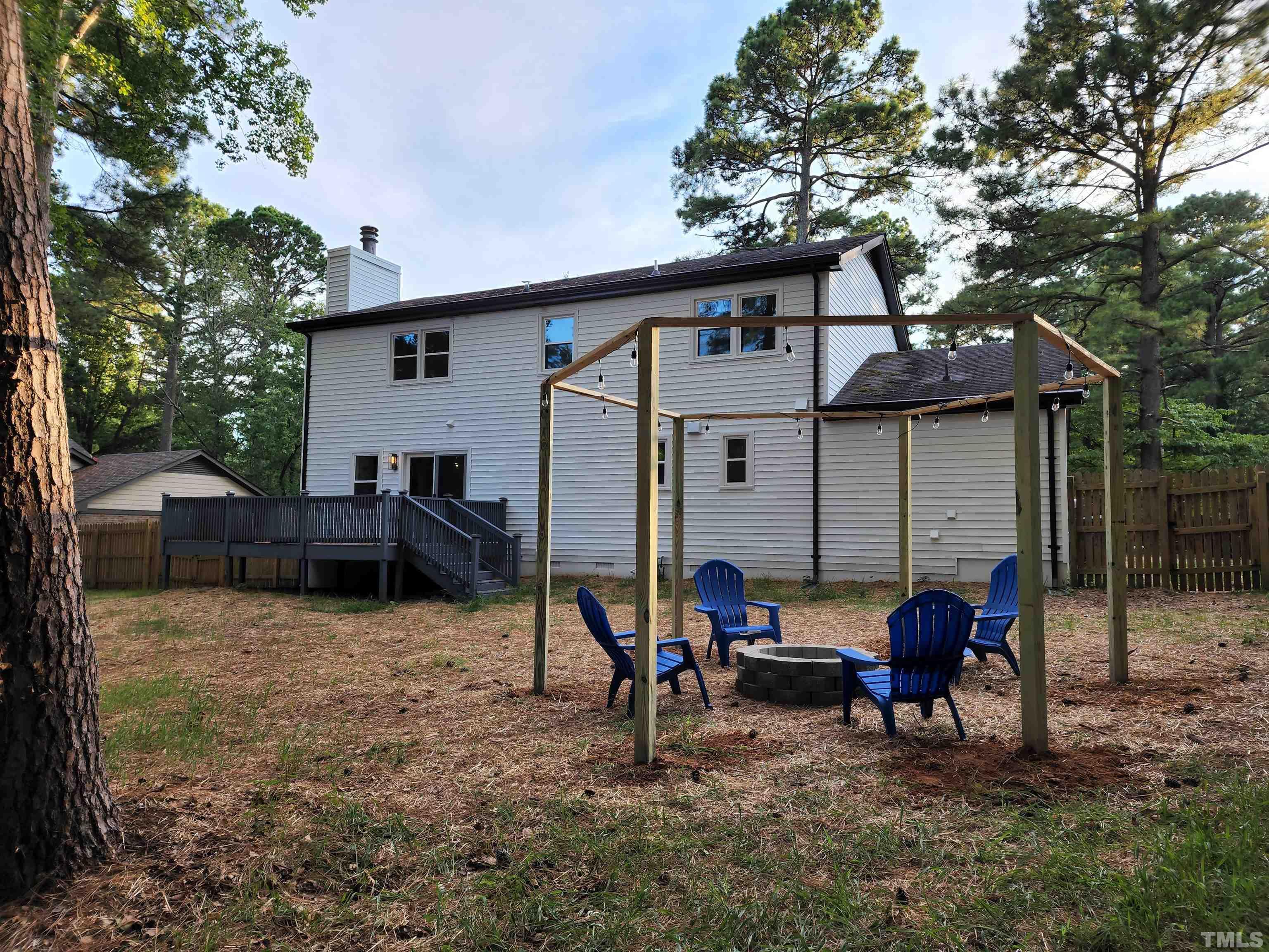 4200 Pickwick Drive Raleigh, NC 27613 - Photo 32 of 36 a view of a house with a patio