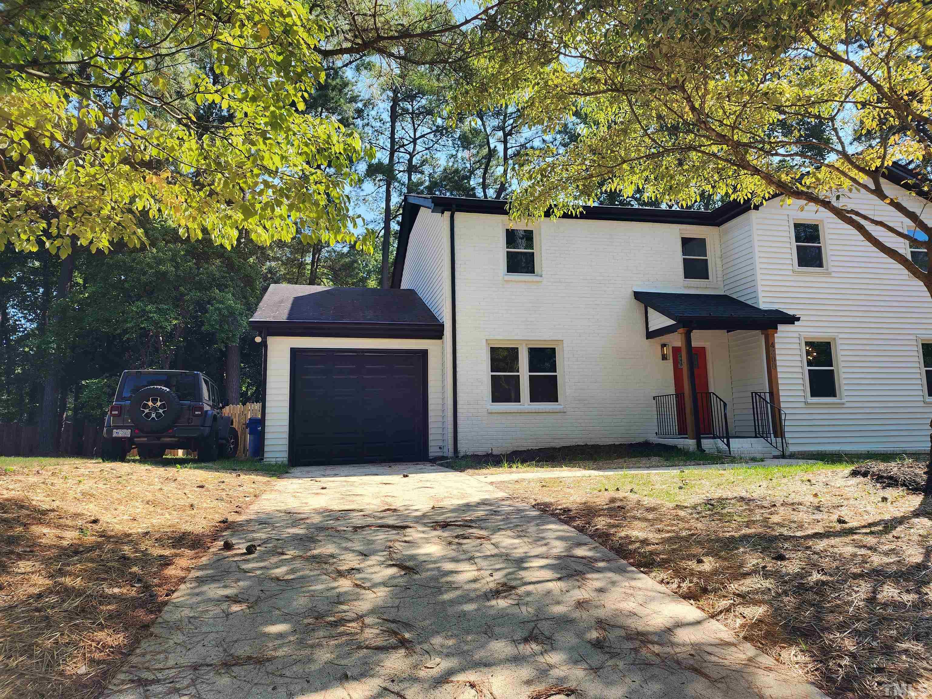 4200 Pickwick Drive Raleigh, NC 27613 - Photo 36 of 36 a view of a house with a yard and tree