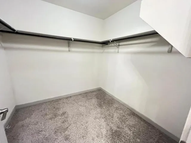 a view of hallway with stainless steel appliances
