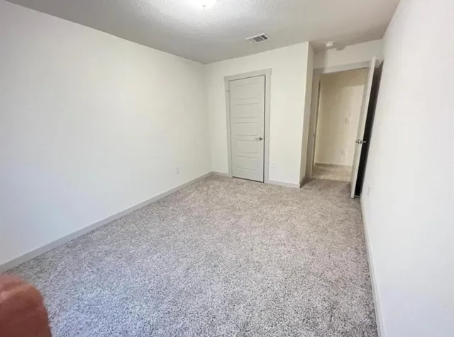 an empty room with a windows