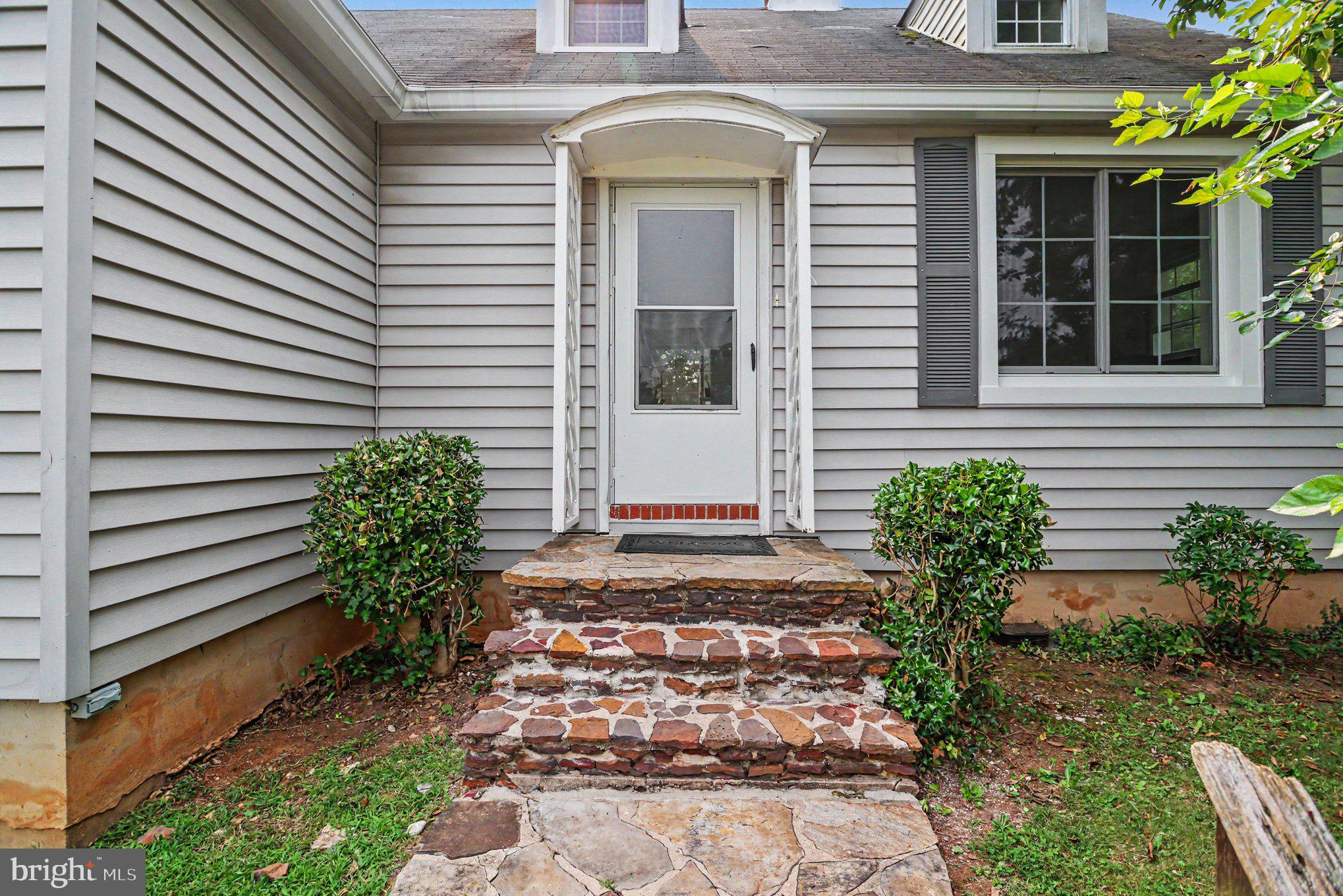 5912 Shady Spring Avenue Baltimore, MD 21237 - Photo 13 of 75 Charming entrance with stone pathway.