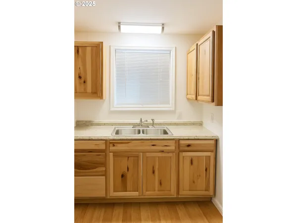a kitchen with a refrigerator and a stove