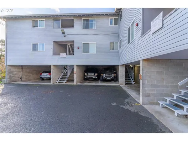 a view of a car park in front of house