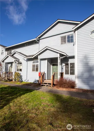 a front view of a house with sitting area