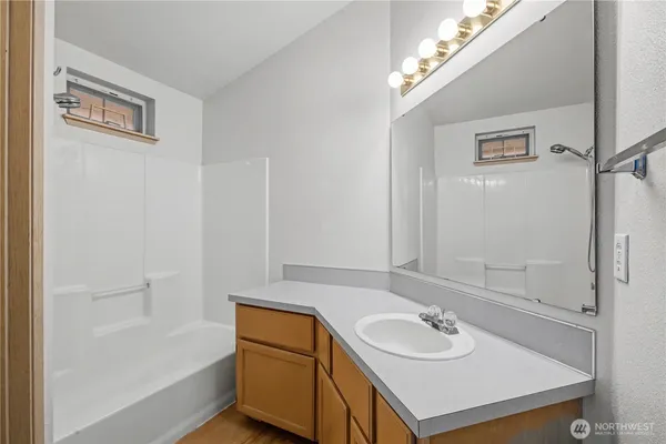 a bathroom with a sink and a mirror