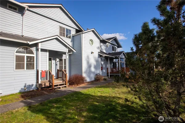 a front view of a house with a yard