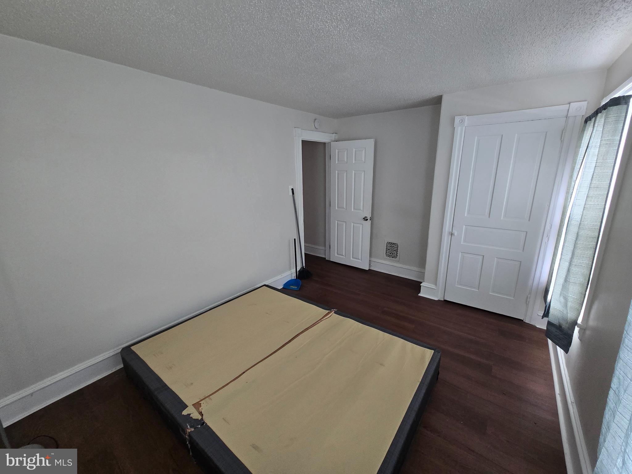 106 Main Street Mantua, NJ 08051 - Photo 11 of 23 an empty room with wooden floor