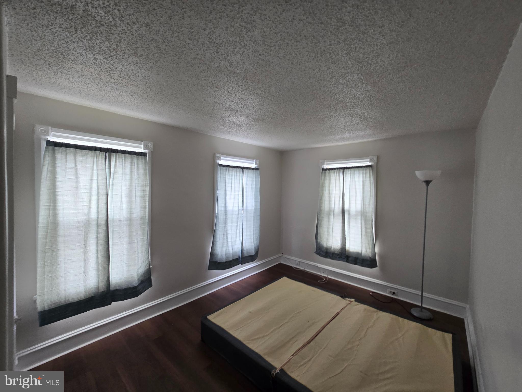 106 Main Street Mantua, NJ 08051 - Photo 12 of 23 an empty room with windows