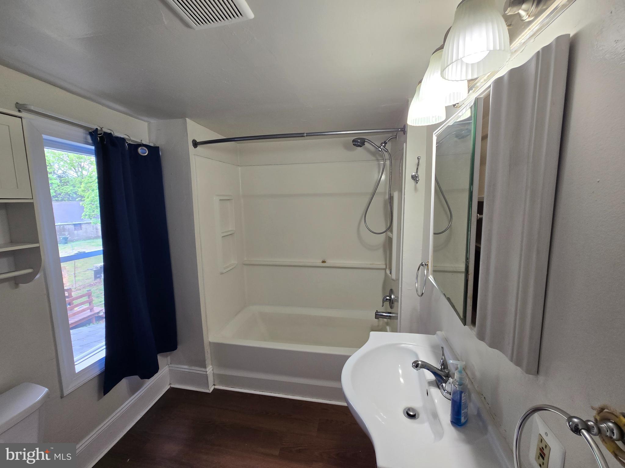 106 Main Street Mantua, NJ 08051 - Photo 16 of 23 a bathroom with a bathtub and a shower