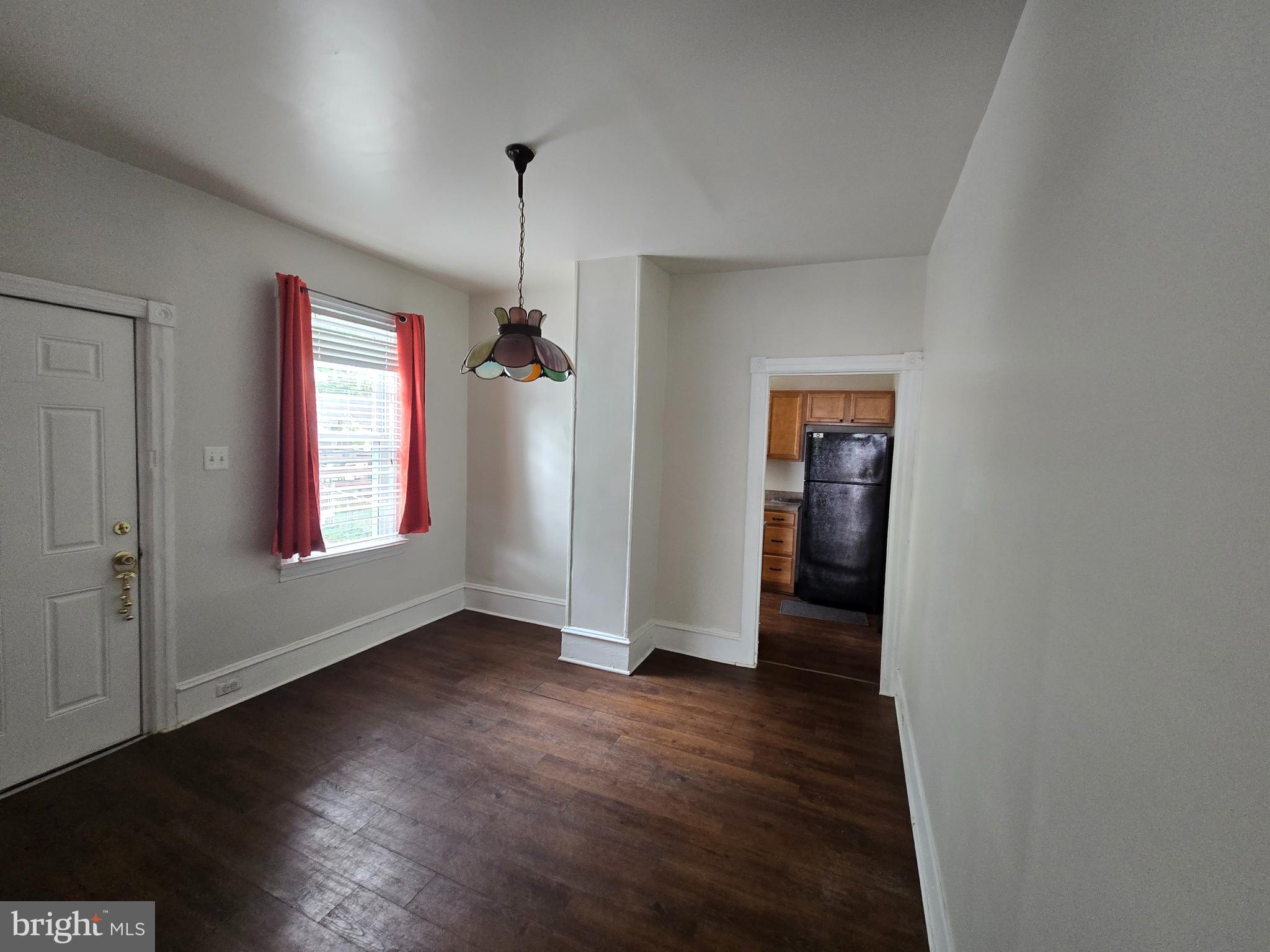 106 Main Street Mantua, NJ 08051 - Photo 5 of 23 an empty room with wooden floor and windows