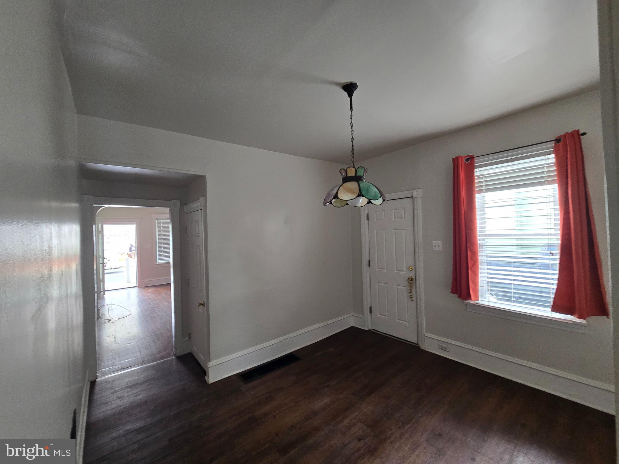 106 Main Street Mantua, NJ 08051 - Photo 6 of 23 a view of empty room with wooden floor and window