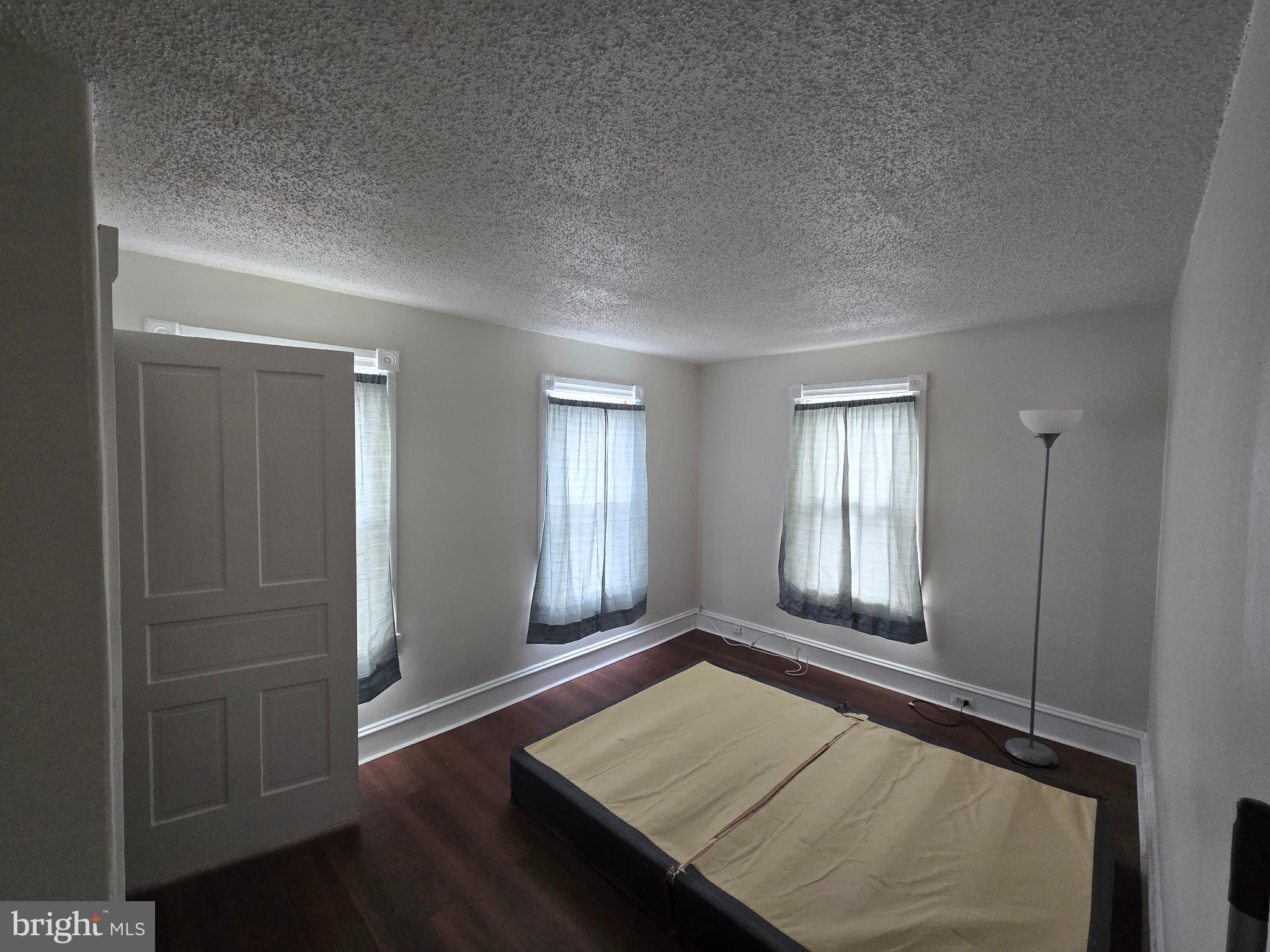106 Main Street Mantua, NJ 08051 - Photo 10 of 23 a view of a room with wooden floor and windows