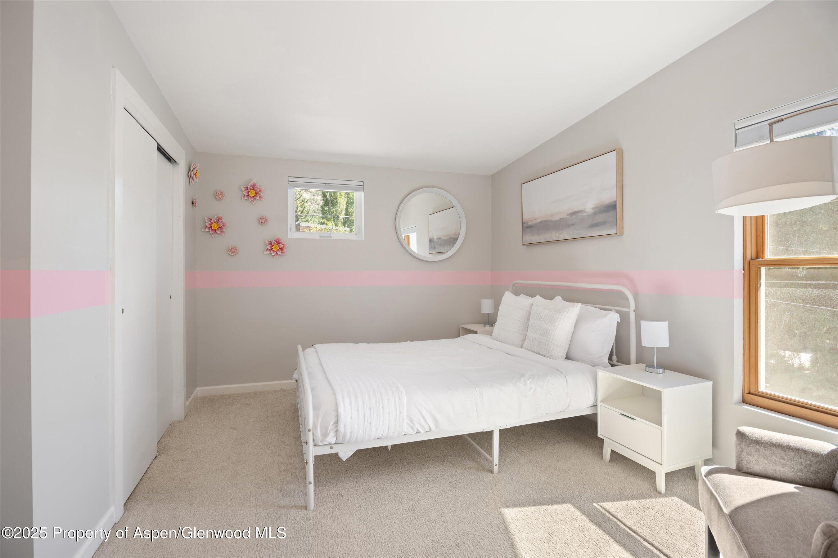 217 Longhorn Lane Basalt, CO 81621 - Photo 13 of 23 a bedroom with a bed and a window