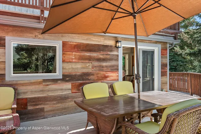 a patio with a table and chairs