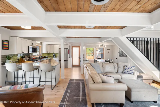 a living room with furniture and a table