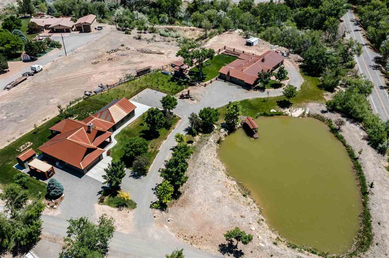 an aerial view of a house with a lake view