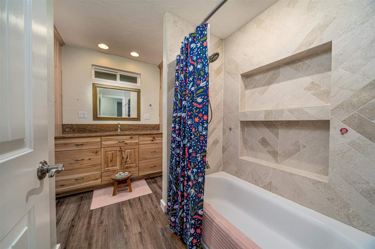 2330 E Road, Unit A & B Grand Junction, CO 81507 - Photo 11 of 35 a bathroom with a bathtub and a shower