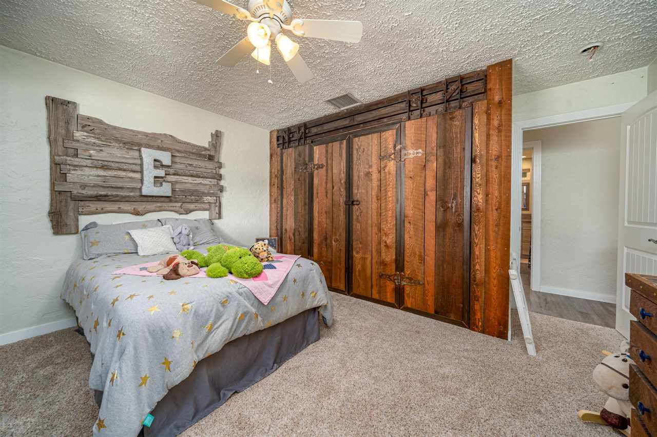 2330 E Road, Unit A & B Grand Junction, CO 81507 - Photo 12 of 35 a bedroom with bed and a window