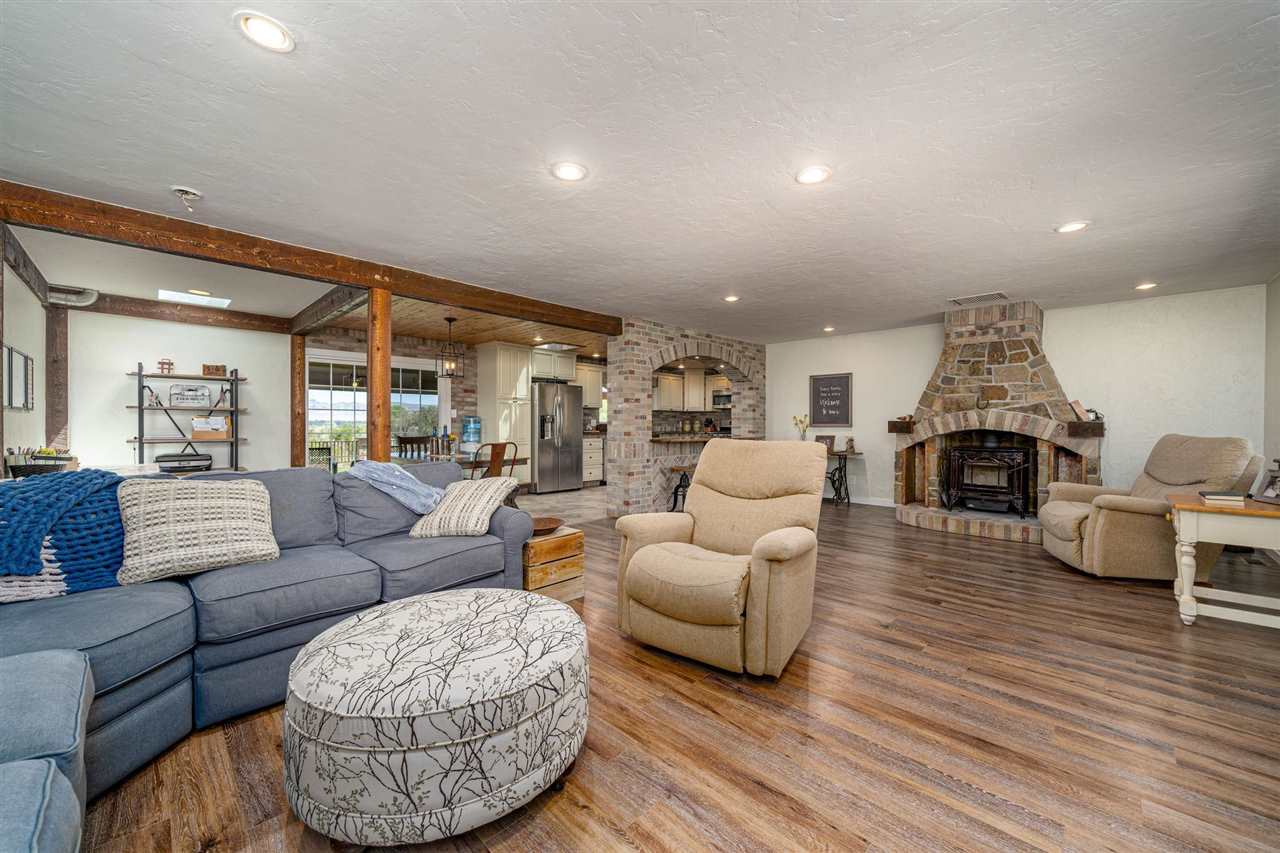 2330 E Road, Unit A & B Grand Junction, CO 81507 - Photo 17 of 35 a living room with furniture and a fireplace