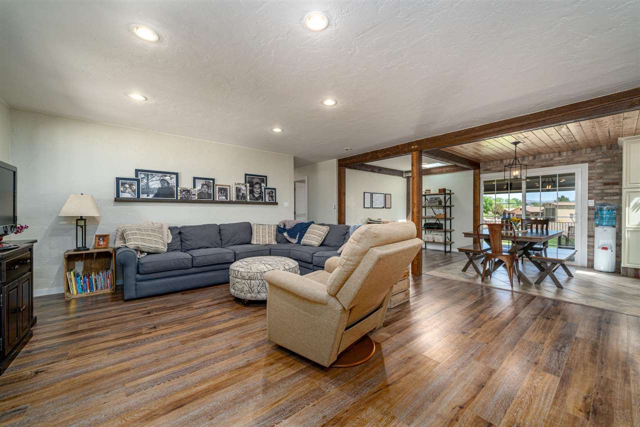 2330 E Road, Unit A & B Grand Junction, CO 81507 - Photo 18 of 35 a living room with furniture and a wooden floor