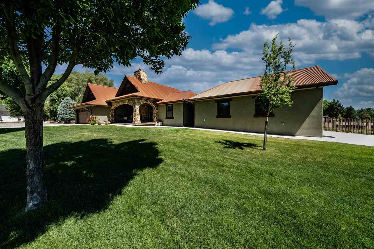 2330 E Road, Unit A & B Grand Junction, CO 81507 - Photo 19 of 35 a front view of a house with a garden