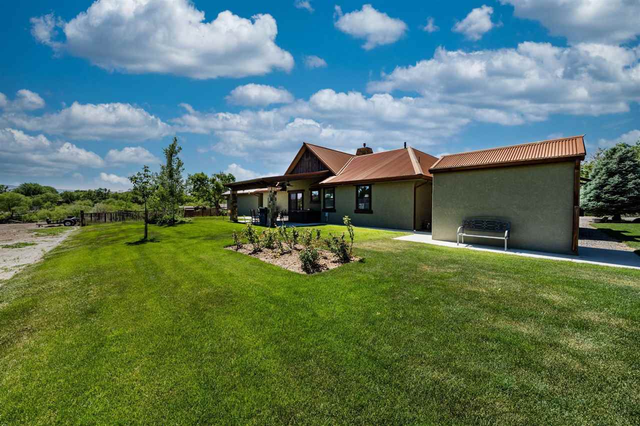 2330 E Road, Unit A & B Grand Junction, CO 81507 - Photo 21 of 35 a view of a house with backyard and porch