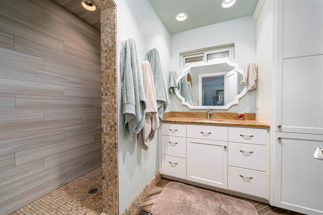 2330 E Road, Unit A & B Grand Junction, CO 81507 - Photo 24 of 35 a bathroom with a sink and a mirror