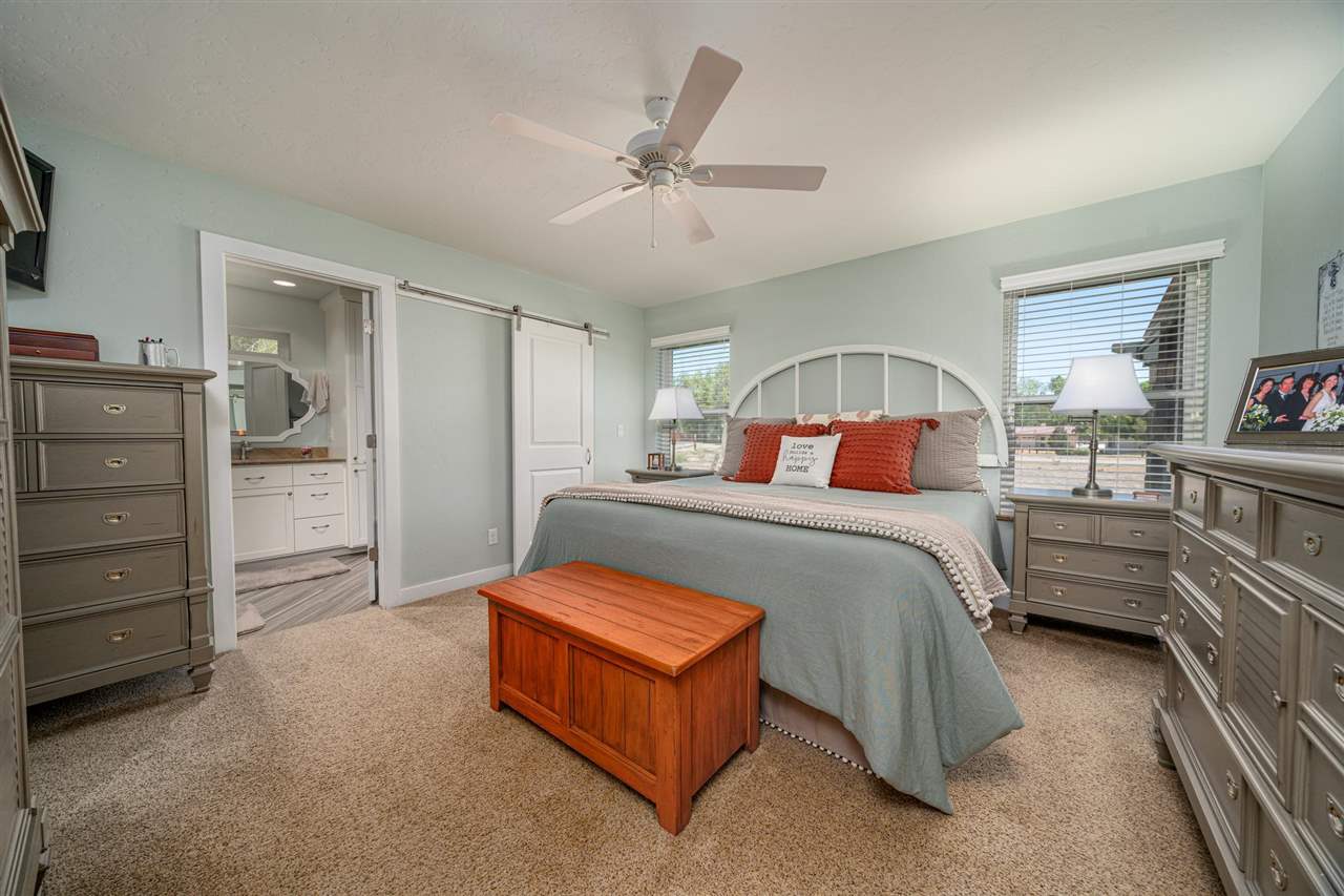 2330 E Road, Unit A & B Grand Junction, CO 81507 - Photo 25 of 35 a bedroom with a bed and dresser