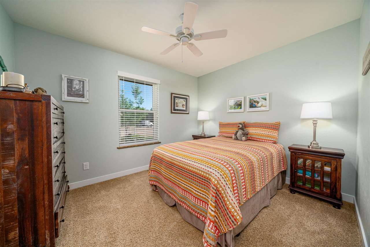 2330 E Road, Unit A & B Grand Junction, CO 81507 - Photo 35 of 35 a bedroom with a bed and a tv on the dresser
