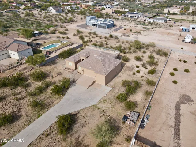 an aerial view of residential houses with outdoor space