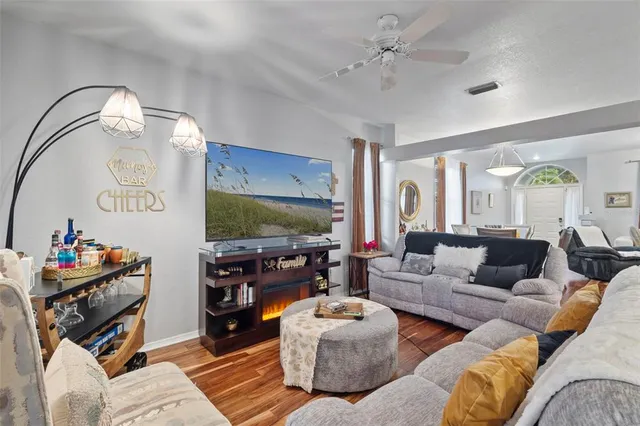 a living room with furniture and a flat screen tv