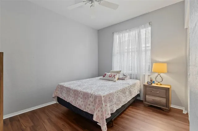 a bedroom with a bed and a mirror