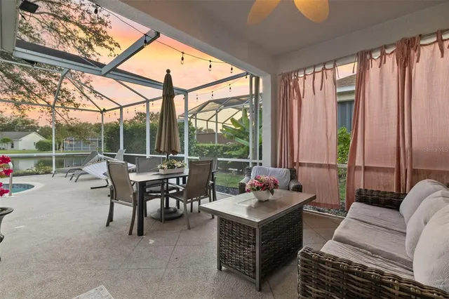 a view of a swimming pool with a patio