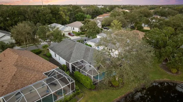 a view of a houses with green field